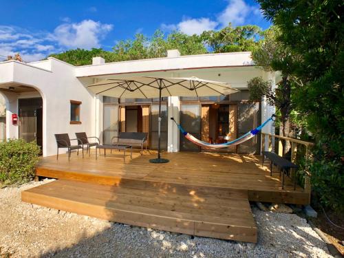 Фотография гостевого дома 沖縄の自然と文化を体験できるゲストハウス一番座