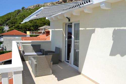 Фотография гостевого дома Apartments by the sea Duce, Omis - 8378