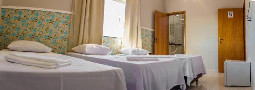 Фотография гостевого дома Pouso Oliveira Suítes