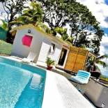 Фотография гостевого дома Bungalow d'une chambre avec piscine partagee jardin clos et wifi a Petit Bourg