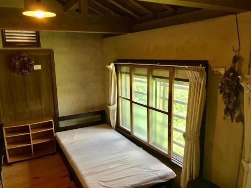 Фотография гостевого дома Travelers House おーさんてぃん青空舎