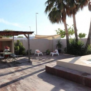 Фотография гостевого дома Casa familiar en primera linea de playa Puzol con piscina