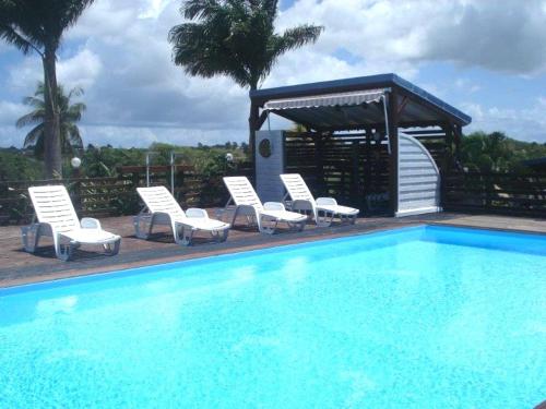 Фотография гостевого дома Maison de 3 chambres avec piscine partagee jardin clos et wifi a Sainte Anne a 3 km de la plage