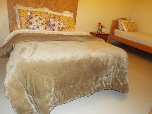 Фотография гостевого дома Suítes econômica 250 metros do mar