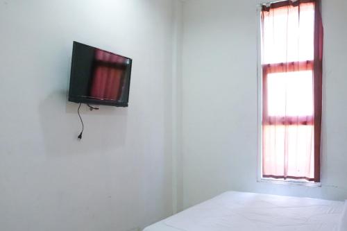 Фотография гостиницы RedDoorz Syariah near Universitas Jenderal Soedirman 2