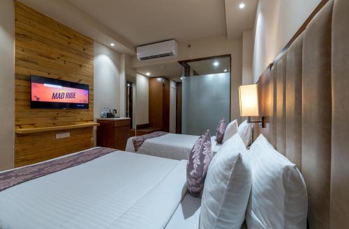 Фотографии гостиницы 
            Hotel Cachar Club by Siara