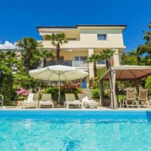 Фотографии гостевого дома 
            Family friendly apartments with a swimming pool Opatija - 7916