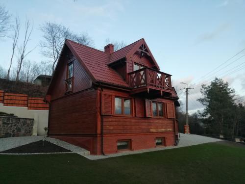 Фотография гостевого дома Całoroczny, Drewniany Domek letniskowy nad rzeką