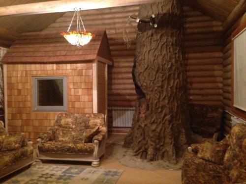 Фотографии гостевого дома 
            Таёжная избушка с баней