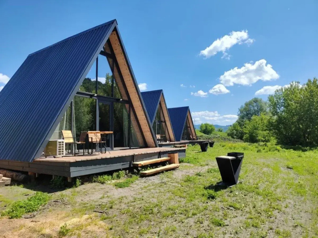 Фотография Коттеджа Шале двухэтажный А-фрейм с панорамным остеклением и террасой