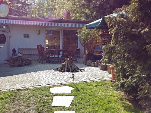 Фотография гостевого дома Holiday home in the beautiful Harz region with wood stove, large terrace, barbecue and fire pit