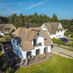 Фотографии гостевого дома 
            Ferienhaus BAYSIDE Schneckenhus LODDIN