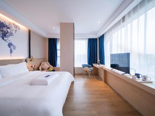 Фотография гостиницы Kyriad Hotel Heyuan Taoyuan International Store