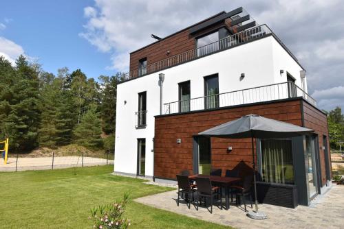 Фотография гостевого дома 5 Sterne-Ferienhaus-See-Sauna-Kamin-Garten im Naturpark