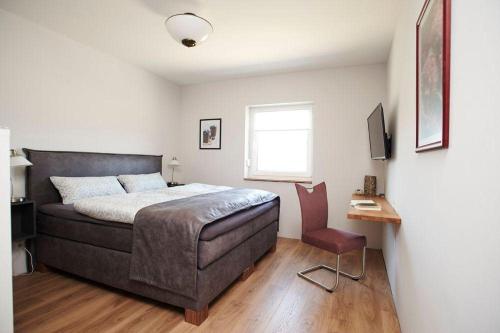 Фотография гостевого дома FRAULINDNERFerien - Doppelzimmer Salzhausen