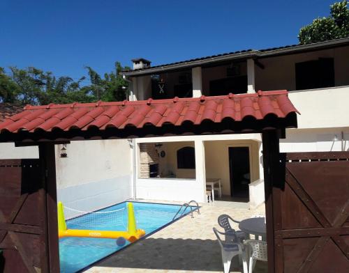 Фотография гостевого дома Casa de Praia com piscina