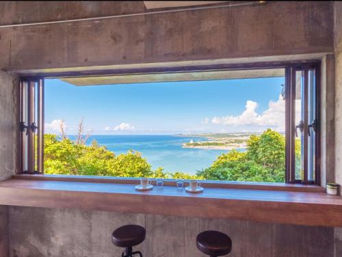 Фотография гостевого дома Kariyushi Condominium Resort Nanjo Atelier Hyakuna