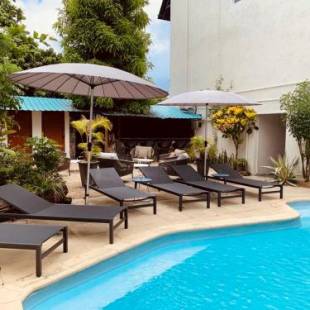 Фотографии гостевого дома 
            Sous Le Badamier