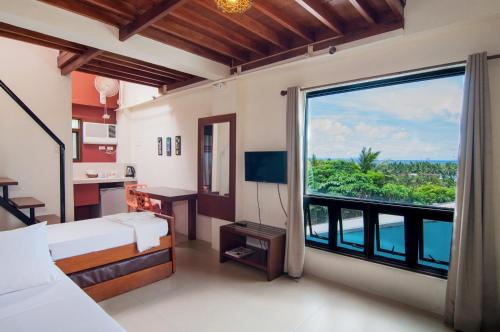 Фотография гостиницы Agos Boracay Rooms + Beds