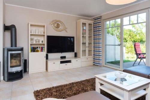 Фотография гостевого дома Ferienhaus Strandschnecke