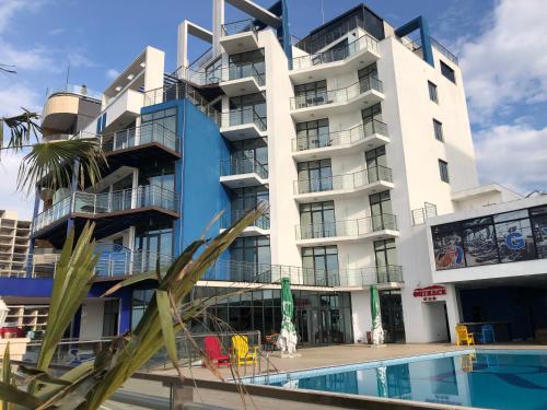 Фотографии гостиницы 
            NEW REALM HOTE