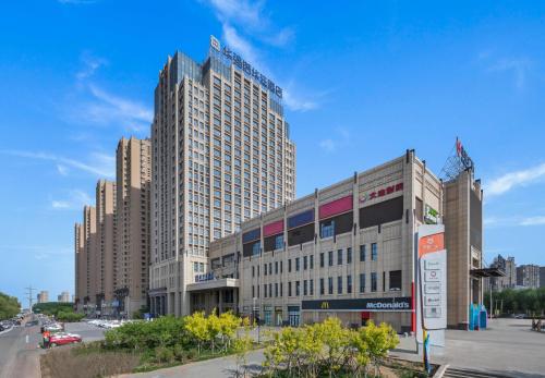 Фотография гостиницы Shenyang Huaqiang Novlion Hotel