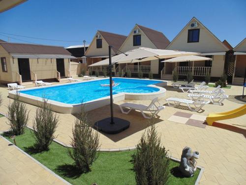 Фотография гостевого дома Коттеджи Сказка