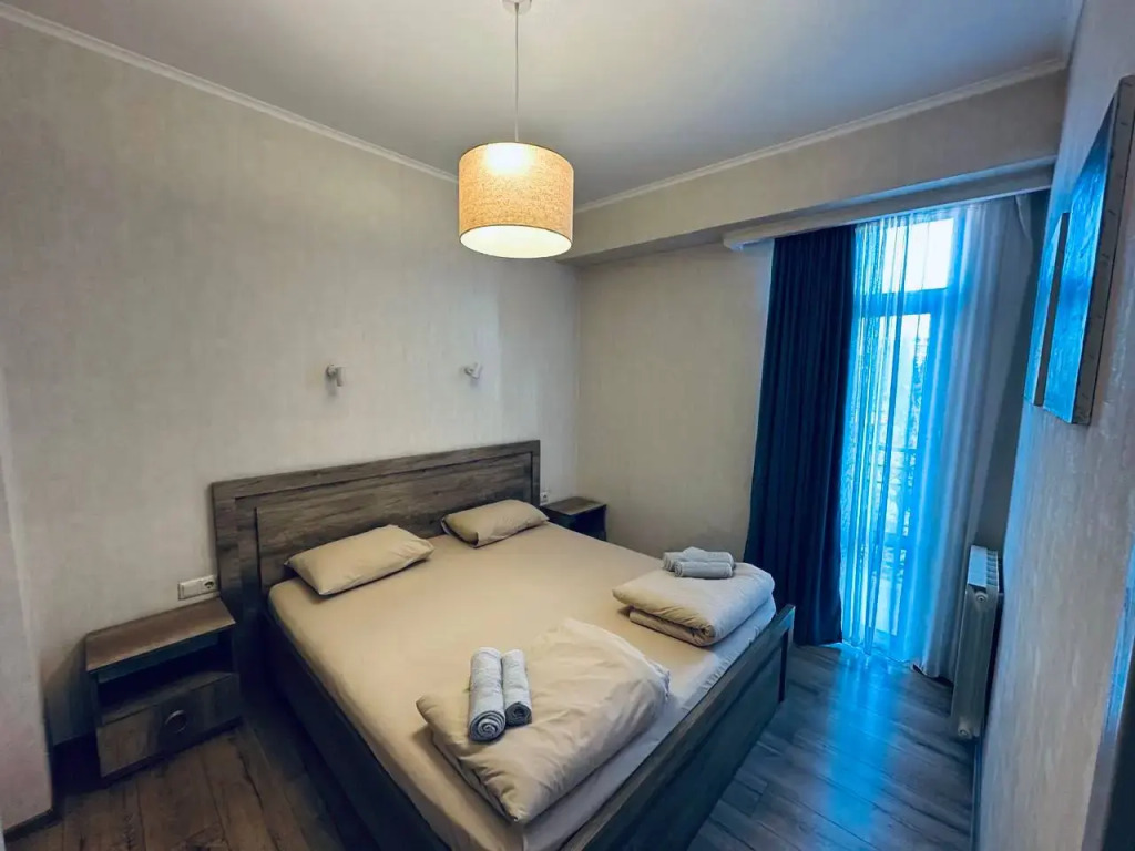 Фотография квартиры Апартаменты в центре с 1 спальней, кухней-гостиной и балконом