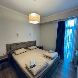 Фотография квартиры Апартаменты в центре с 1 спальней, кухней-гостиной и балконом