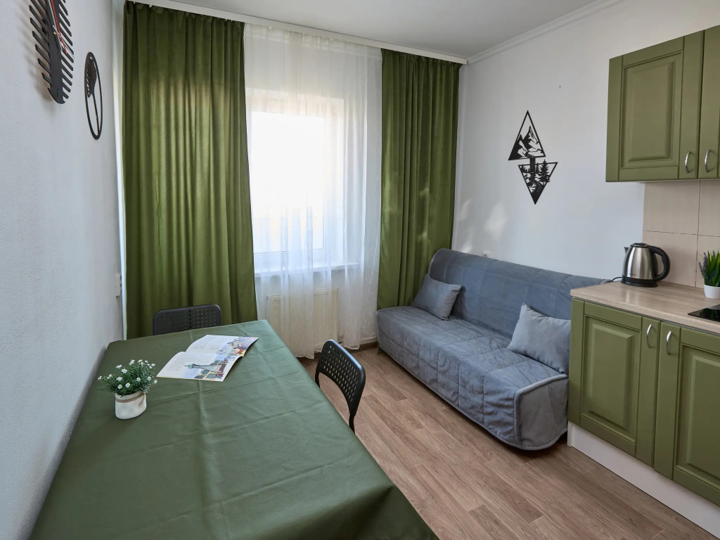 Фотография квартиры Квартира с диваном на кухне и балконом на Байбакова 2